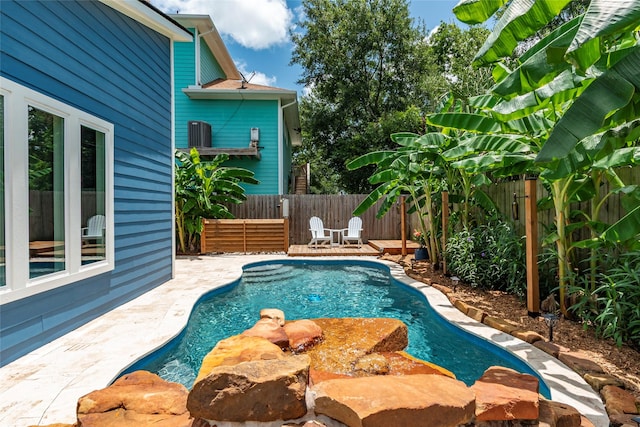 1017 Forest Rd, Clear Lake Shores, TX 77565 - view of swimming pool with a fenced backyard and a patio area