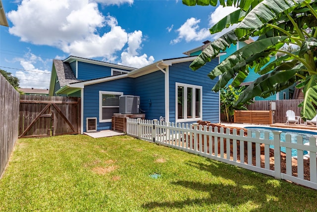 1017 Forest Rd, Clear Lake Shores, TX 77565 - rear view of house with a fenced backyard