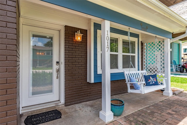 1017 Forest Rd, Clear Lake Shores, TX 77565 - entrance to property featuring a porch and brick siding