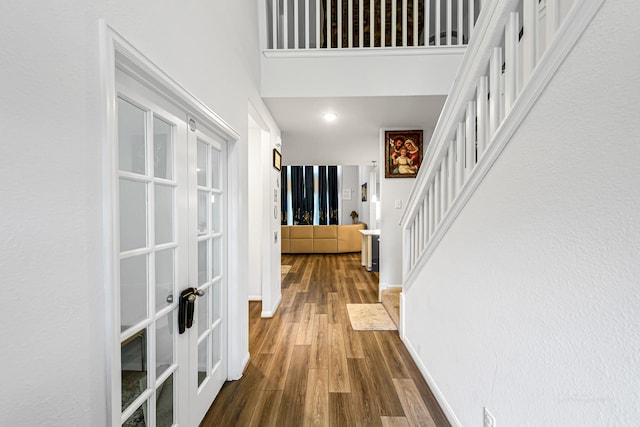 8619 Flamingo Bay Ln, Cypress, TX 77433 - foyer with french doors, wood finished floors, stairway, and a high ceiling