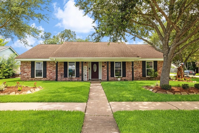 3214 Churchill St, Pearland, TX 77581 - single story home featuring a front lawn, a shingled roof, and brick siding
