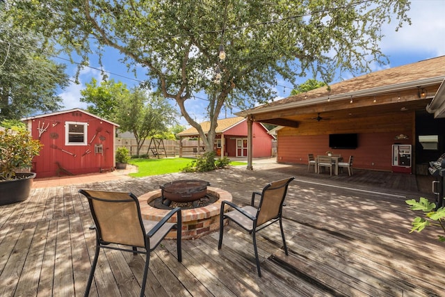 3214 Churchill St, Pearland, TX 77581 - wooden terrace with an outdoor fire pit, ceiling fan, and a storage unit