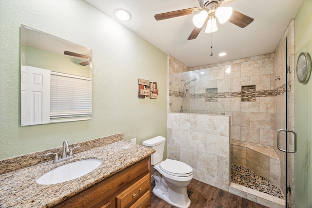3214 Churchill St, Pearland, TX 77581 - bathroom featuring a ceiling fan, vanity, a shower stall, and wood finished floors