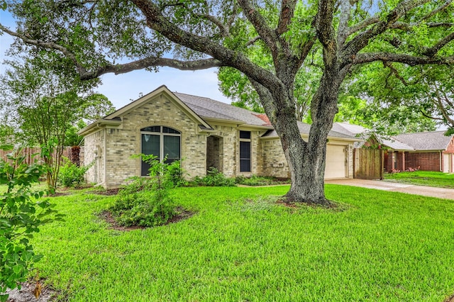 7215 Pembrough Ln, Katy, TX 77494 - ranch-style house featuring a garage, concrete driveway, and brick siding