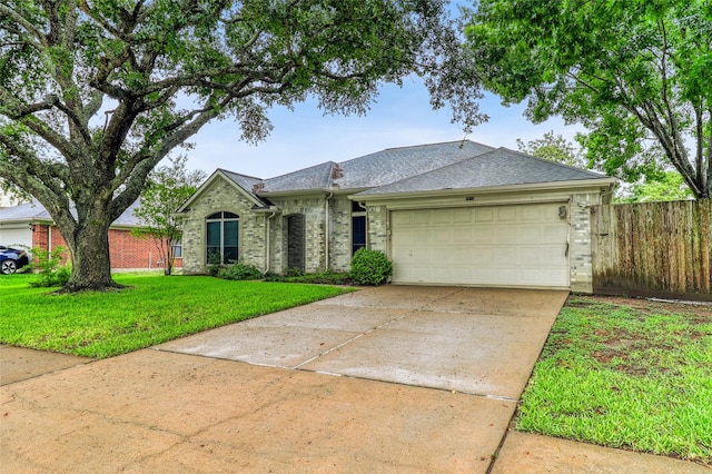 7215 Pembrough Ln, Katy, TX 77494 - single story home featuring driveway, a garage, brick siding, and roof with shingles