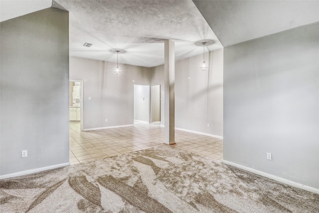 7215 Pembrough Ln, Katy, TX 77494 - tiled empty room with baseboards and carpet floors