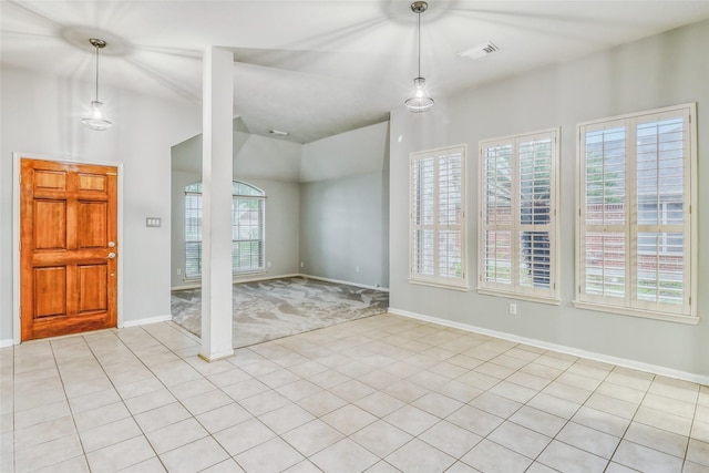 7215 Pembrough Ln, Katy, TX 77494 - entrance foyer featuring plenty of natural light, lofted ceiling, light tile patterned flooring, and light carpet