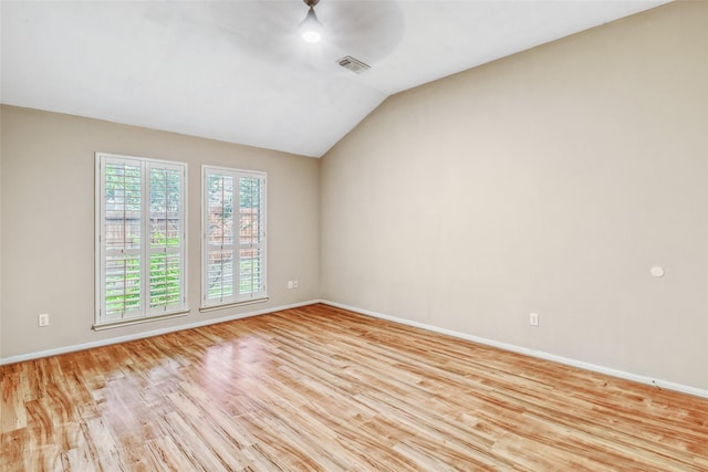 7215 Pembrough Ln, Katy, TX 77494 - empty room featuring light wood-type flooring, ceiling fan, and vaulted ceiling