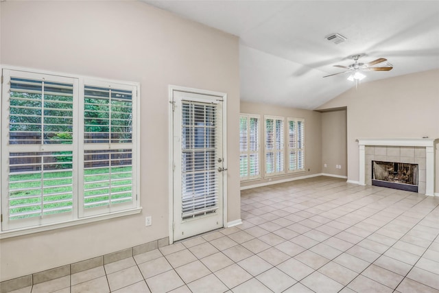 7215 Pembrough Ln, Katy, TX 77494 - unfurnished living room with lofted ceiling, a ceiling fan, a fireplace, and light tile patterned floors