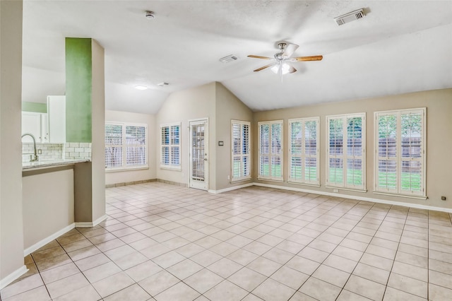 7215 Pembrough Ln, Katy, TX 77494 - unfurnished living room with a ceiling fan, lofted ceiling, and light tile patterned floors
