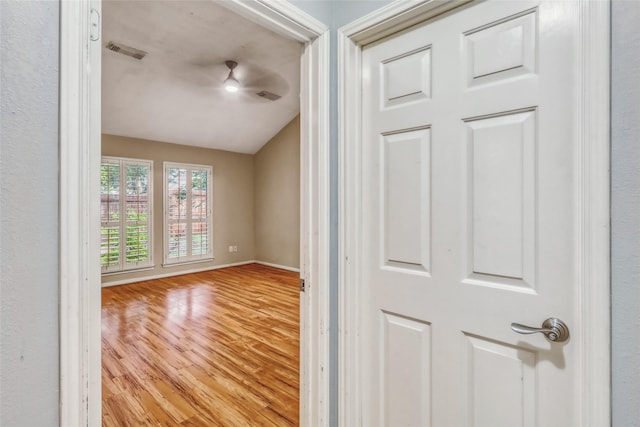 7215 Pembrough Ln, Katy, TX 77494 - unfurnished room featuring vaulted ceiling and wood finished floors
