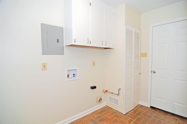 823 Timber Cove Dr, Seabrook, TX 77586 - laundry area featuring electric panel, brick flooring, cabinet space, washer hookup, and hookup for an electric dryer