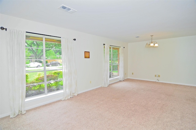 823 Timber Cove Dr, Seabrook, TX 77586 - unfurnished room featuring a chandelier and light carpet