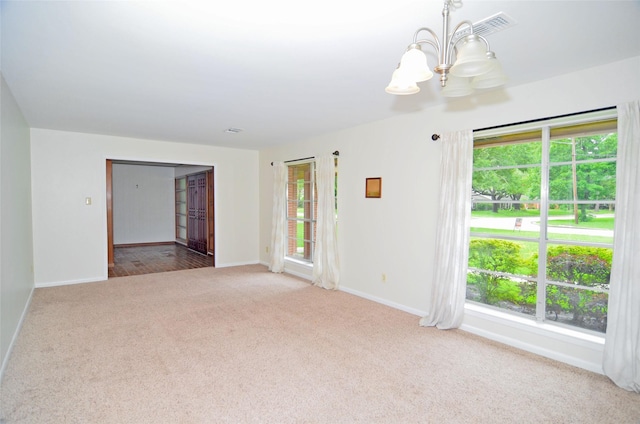 823 Timber Cove Dr, Seabrook, TX 77586 - spare room with a chandelier and carpet