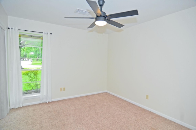 823 Timber Cove Dr, Seabrook, TX 77586 - spare room featuring light carpet, healthy amount of natural light, and a ceiling fan