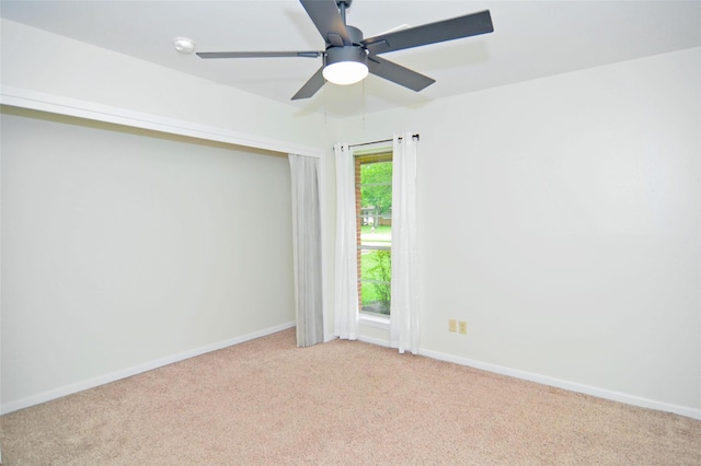 823 Timber Cove Dr, Seabrook, TX 77586 - empty room featuring light carpet and ceiling fan