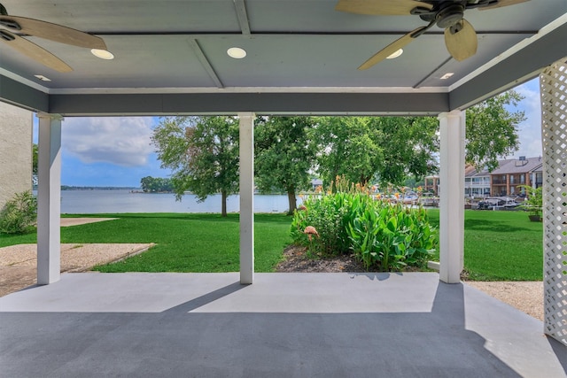 1437 Bowsprit Pt, Willis, TX 77318 - view of patio / terrace with ceiling fan and a water view