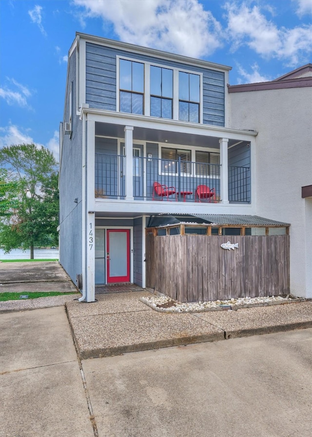 1437 Bowsprit Pt, Willis, TX 77318 - view of front of home with a balcony