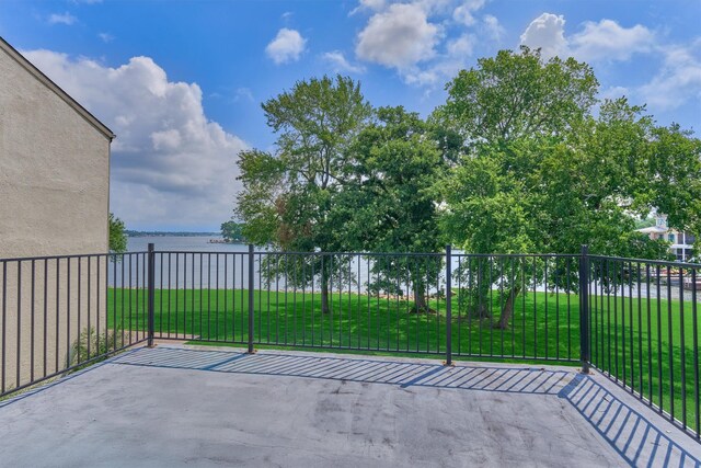 1437 Bowsprit Pt, Willis, TX 77318 - view of patio / terrace with a water view