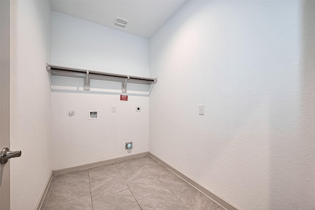 3943 Austins Pass, Katy, TX 77494 - washroom featuring hookup for an electric dryer, hookup for a gas dryer, washer hookup, and light tile patterned floors