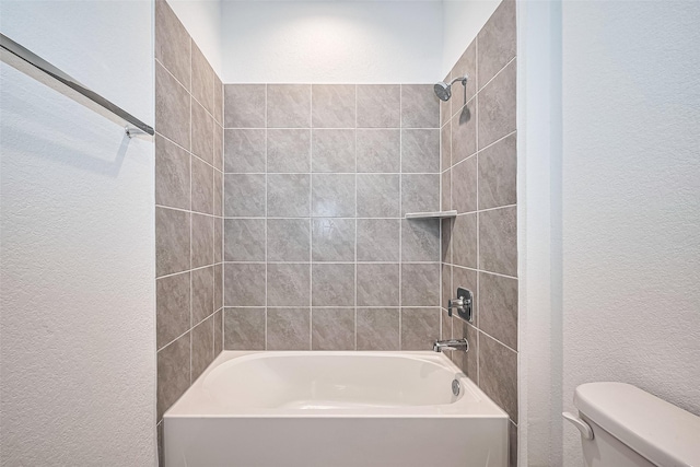 3943 Austins Pass, Katy, TX 77494 - bathroom featuring a textured wall and shower / bath combination