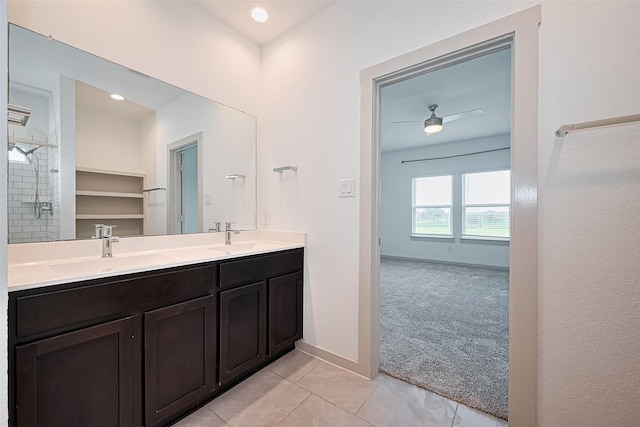 3943 Austins Pass, Katy, TX 77494 - full bathroom with double vanity, ceiling fan, tile patterned flooring, and a tile shower