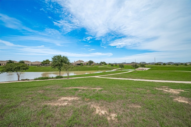 3943 Austins Pass, Katy, TX 77494 - view of home's community featuring a water view, a lawn, and a residential view
