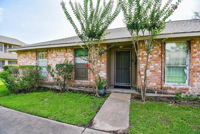 12469 Sharpview Dr Unit 2469, Houston, TX 77072 - view of front of property with brick siding and a front lawn