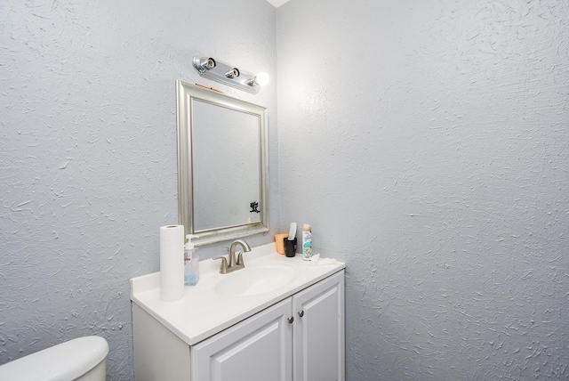 12469 Sharpview Dr Unit 2469, Houston, TX 77072 - bathroom with vanity and a textured wall
