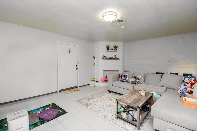 12469 Sharpview Dr Unit 2469, Houston, TX 77072 - living area with a fireplace and brick wall