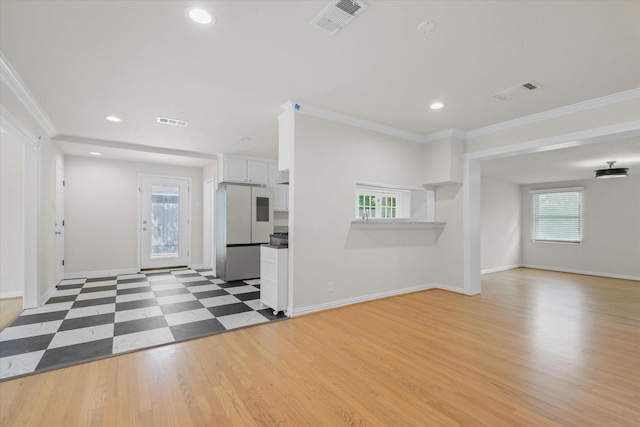 5426 Carew St, Houston, TX 77096 - unfurnished living room featuring crown molding, recessed lighting, and light wood-style floors