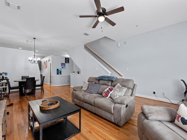 2710 Hullsmith Dr Unit 1004, Houston, TX 77063 - living area featuring a chandelier, a ceiling fan, light wood-style flooring, recessed lighting, and stairs