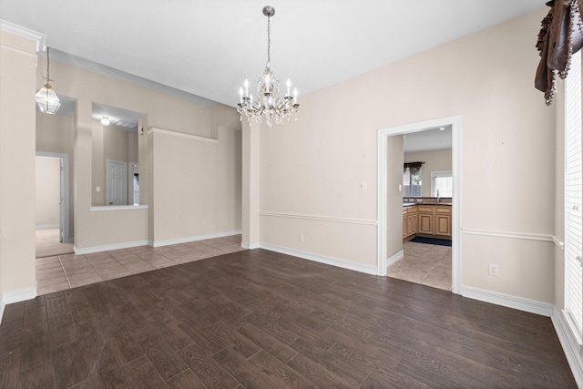 8722 Melting Shadows Ln, Houston, TX 77095 - spare room featuring wood finished floors and a chandelier