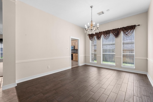 8722 Melting Shadows Ln, Houston, TX 77095 - unfurnished room featuring dark wood finished floors and a chandelier