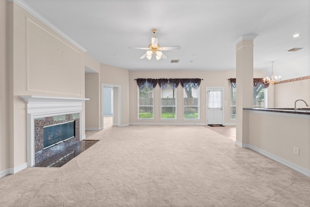 8722 Melting Shadows Ln, Houston, TX 77095 - unfurnished living room with carpet, a chandelier, a ceiling fan, and a high end fireplace