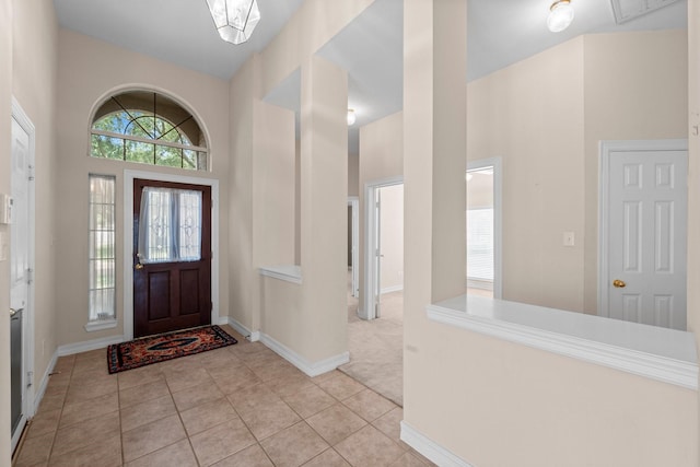 8722 Melting Shadows Ln, Houston, TX 77095 - entrance foyer featuring light tile patterned flooring and a towering ceiling