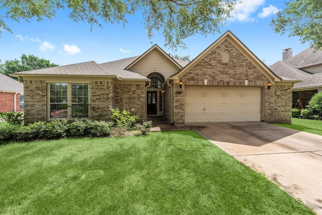 8722 Melting Shadows Ln, Houston, TX 77095 - ranch-style home featuring brick siding, a garage, driveway, and a front lawn