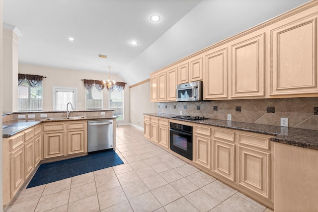 8722 Melting Shadows Ln, Houston, TX 77095 - kitchen with black appliances, lofted ceiling, a chandelier, light brown cabinets, and light tile patterned floors