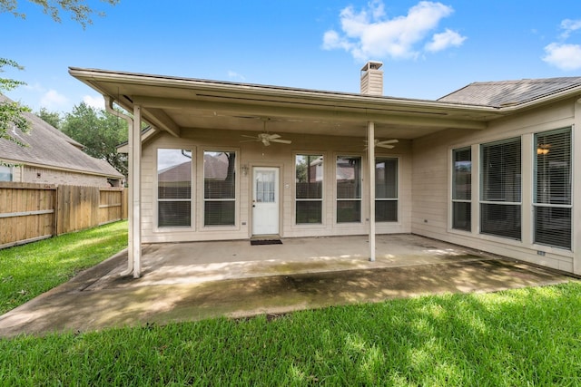 8722 Melting Shadows Ln, Houston, TX 77095 - back of property with ceiling fan, a chimney, and a patio