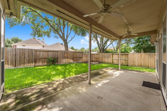 8722 Melting Shadows Ln, Houston, TX 77095 - fenced backyard with a ceiling fan and a patio