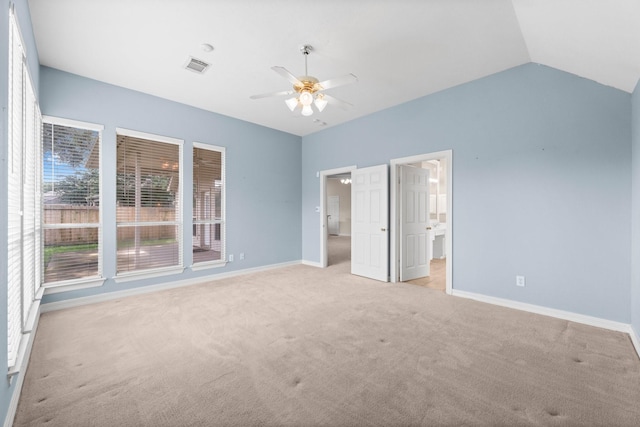 8722 Melting Shadows Ln, Houston, TX 77095 - unfurnished bedroom featuring light carpet, vaulted ceiling, a ceiling fan, and connected bathroom