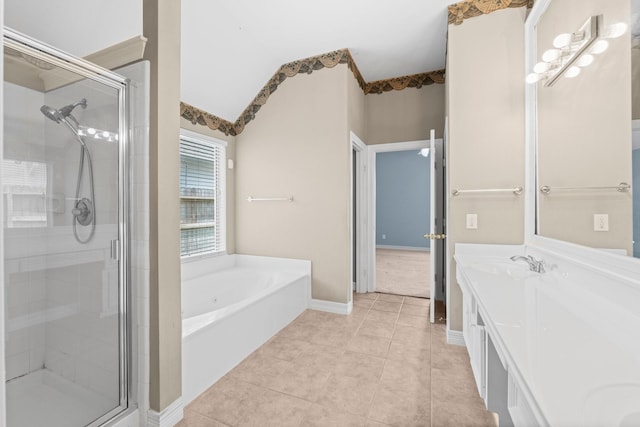 8722 Melting Shadows Ln, Houston, TX 77095 - bathroom with a stall shower, a garden tub, double vanity, and tile patterned floors