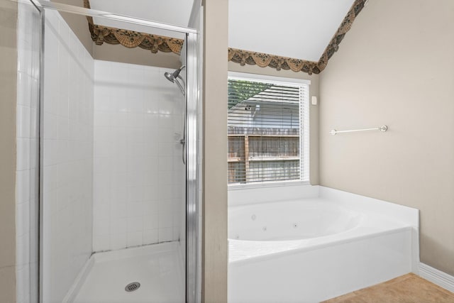 8722 Melting Shadows Ln, Houston, TX 77095 - full bathroom with a stall shower, a jetted tub, and tile patterned floors