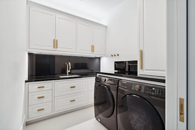 2707 Westgrove Ln, Houston, TX 77027 - laundry area featuring washing machine and dryer and cabinet space