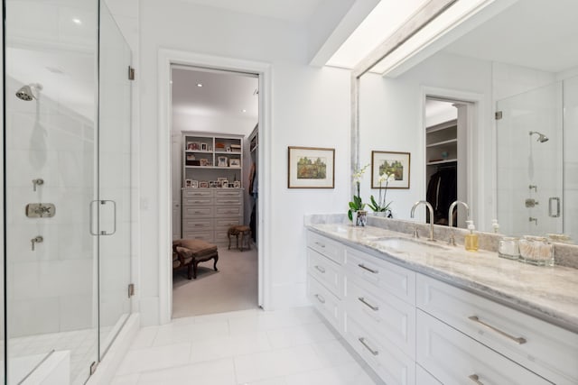 2707 Westgrove Ln, Houston, TX 77027 - bathroom featuring a spacious closet, vanity, and a shower stall