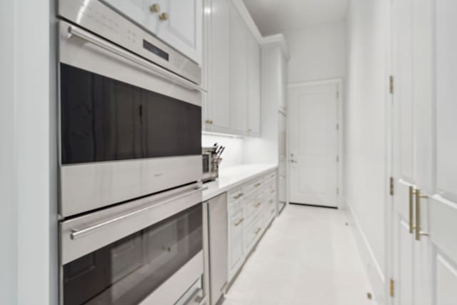 2707 Westgrove Ln, Houston, TX 77027 - kitchen with double oven, white cabinets, and light countertops