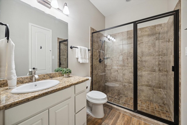 27722 Lakeway Trail Ln, Fulshear, TX 77441 - bathroom with vanity, a shower stall, and wood finished floors
