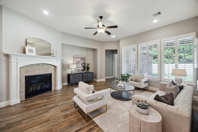 27722 Lakeway Trail Ln, Fulshear, TX 77441 - living room featuring a ceiling fan, wood finished floors, a tile fireplace, and recessed lighting