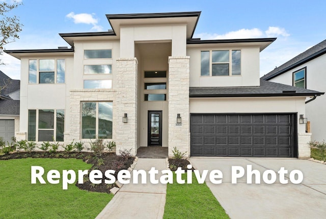 10922 Palmwood Dr, Missouri City, TX 77459 - view of front of house with driveway, stucco siding, an attached garage, a front lawn, and stone siding