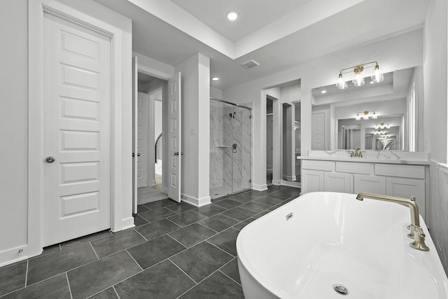 10922 Palmwood Dr, Missouri City, TX 77459 - full bath with a stall shower, a freestanding bath, vanity, and recessed lighting